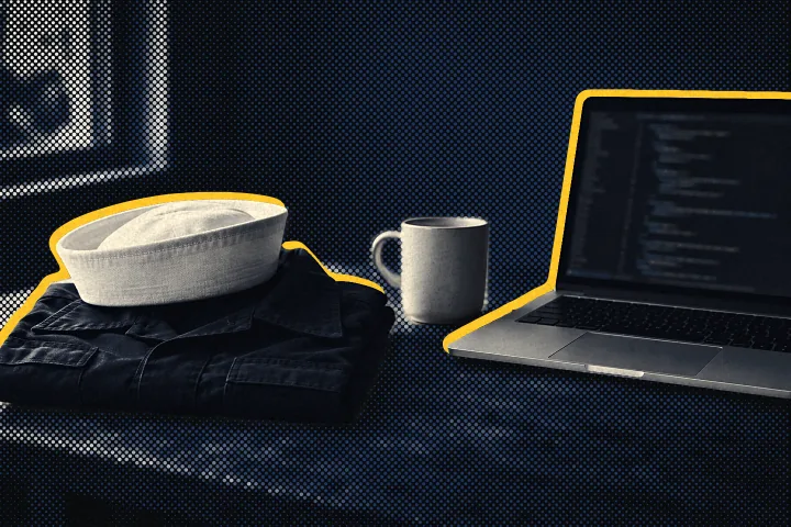 Halftone photo of a folded Navy work shirt and white sailor’s cap beside a laptop showing code.